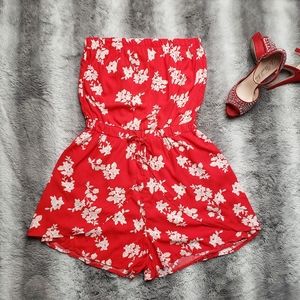 Red rompers with white flowers